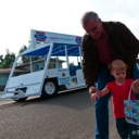 Papa helping Adelaine pick up candy.