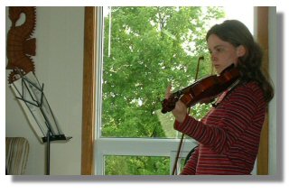 Naomi still tries to keep up her violin skills.